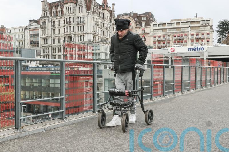 Paralysed men stand, walk and swim again thanks to new implant
