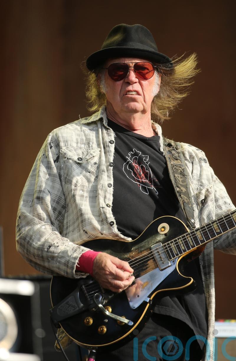 Neil Young urges Spotify employees to leave company ‘before it eats your soul’