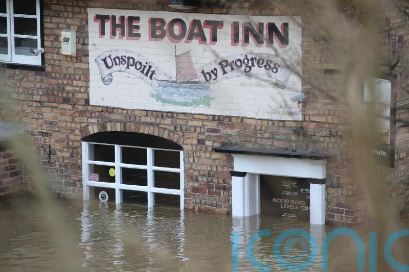 Wind and snow warnings issued as flooding risks remain