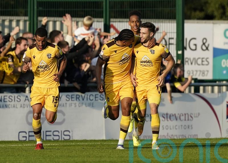 Sutton sink sorry Scunthorpe to get back to winning ways