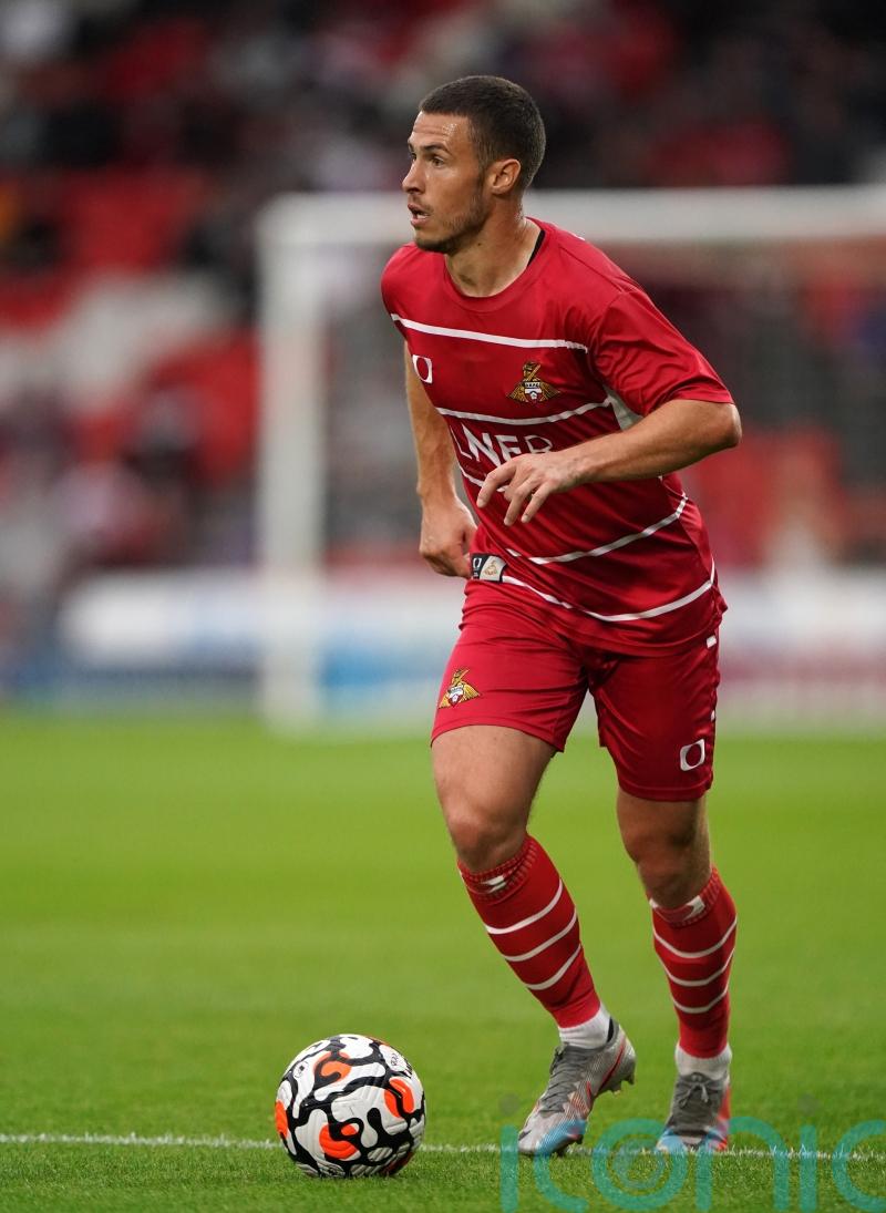 Tommy Rowe scores twice as Doncaster hit back to draw at Wimbledon