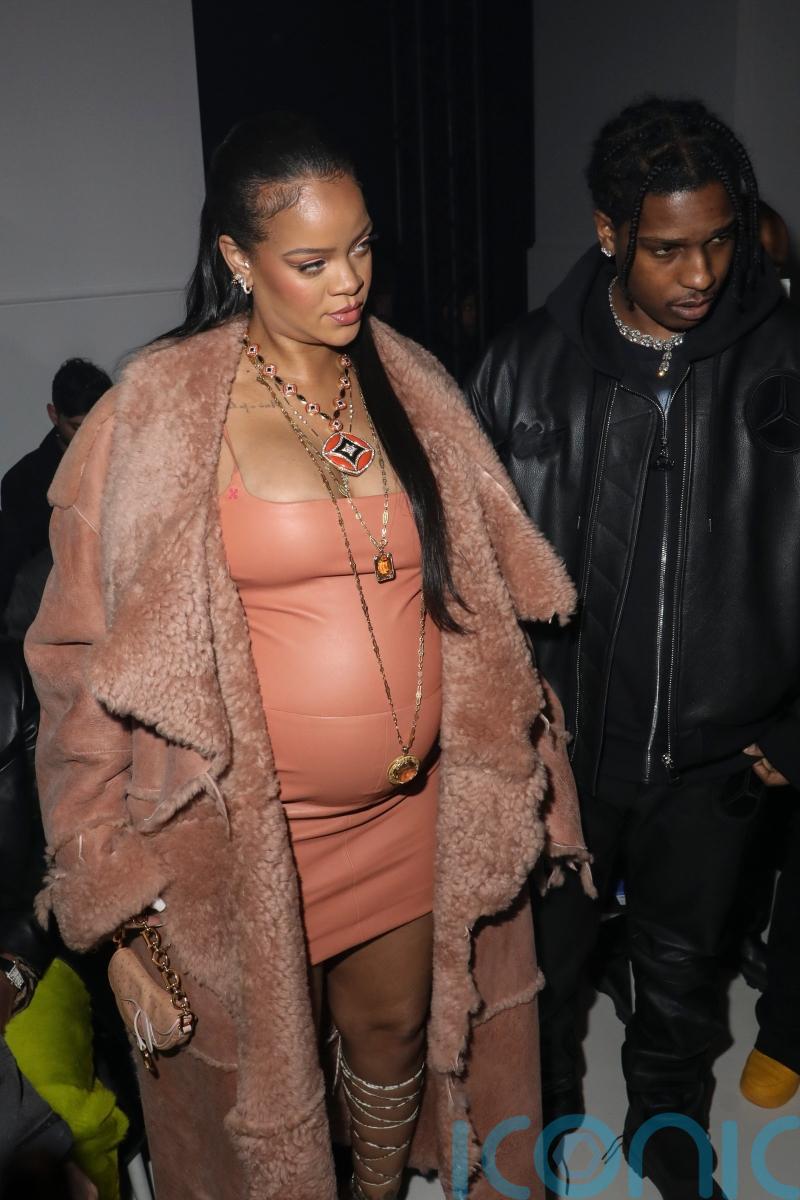 Rihanna shows off baby bump in skintight leather at Off-White fashion show