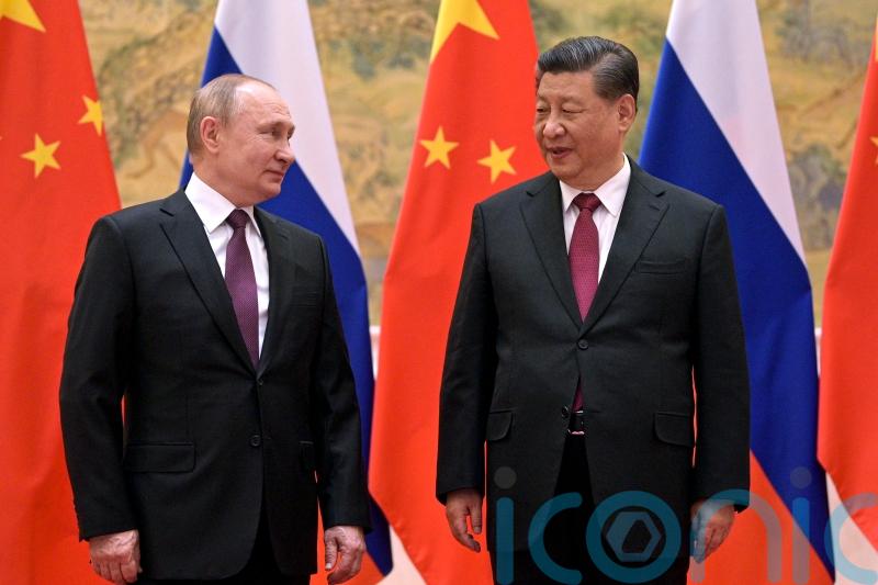 China denies asking Russia not to invade until post-Olympics