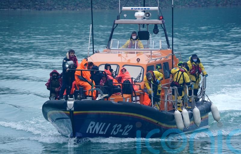 Migrants brought ashore by RNLI and Border Force after crossing Channel