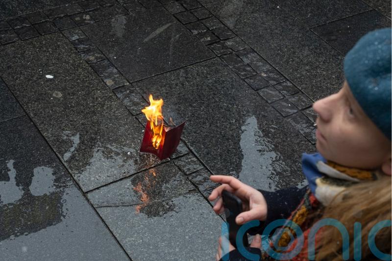 Russian man burns passport to show anger over invasion of Ukraine