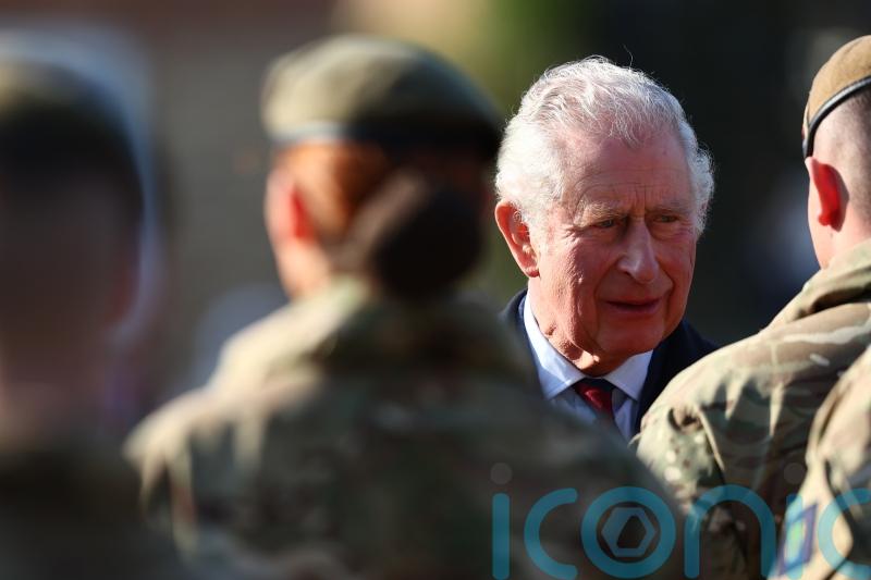 Charles presents medals to troops on Operation Shader