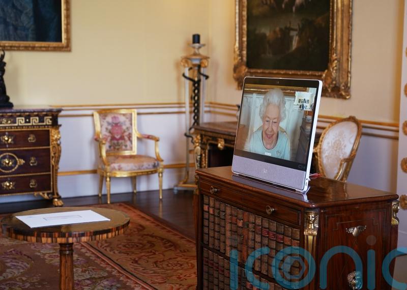 Smiling Queen holds virtual audiences at Windsor