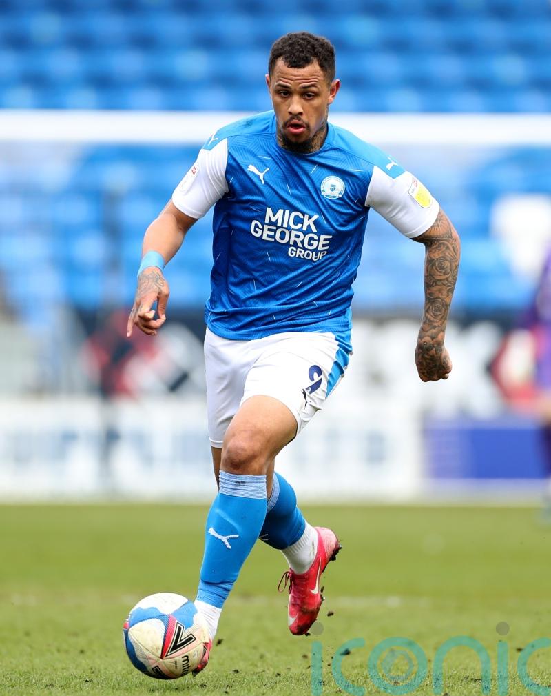 Jonson Clarke-Harris’ late penalty earns Peterborough a point against Stoke