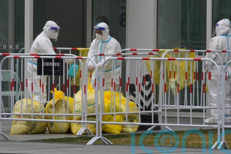 China shuts business centre of Shenzhen to fight Covid surge