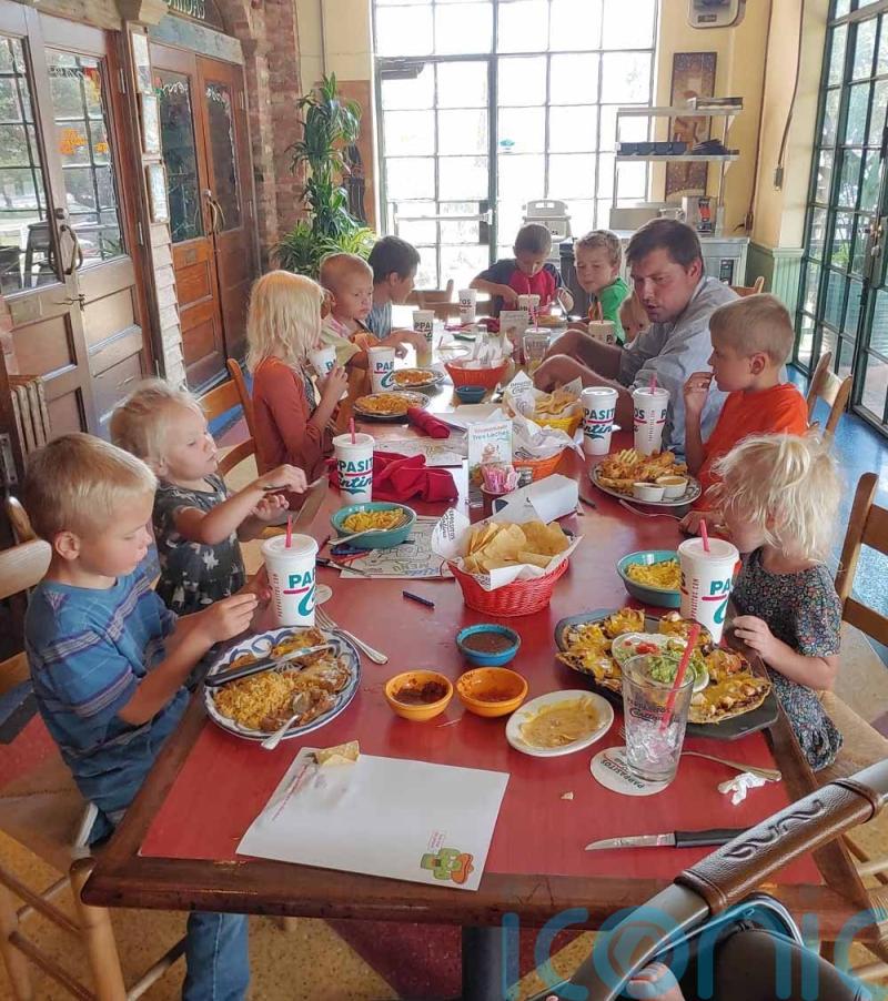 Devoted couple wet their 12th baby’s head and become the real life Cheaper by the Dozen family after having 12 children in 12 years