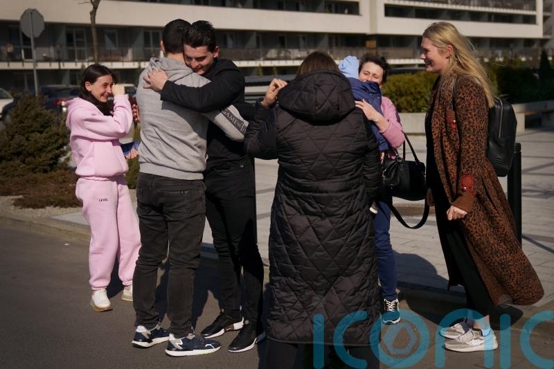 UK-based Russian-Ukrainian couple reunited with family at visa centre in Poland