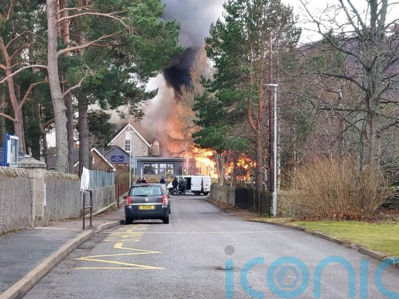 Hotel goes up in flames after blaze spreads from shed