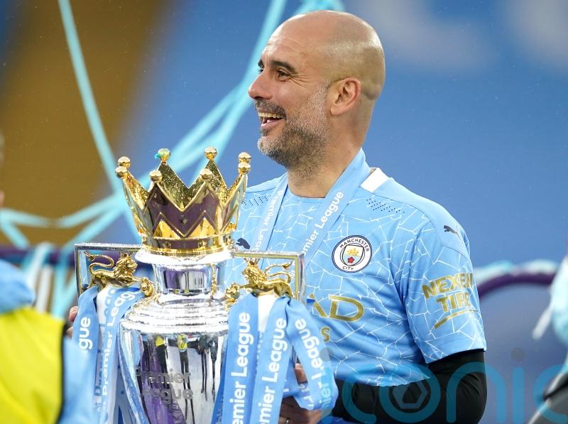 Pep Guardiola tries to play down talk of Manchester City winning the treble