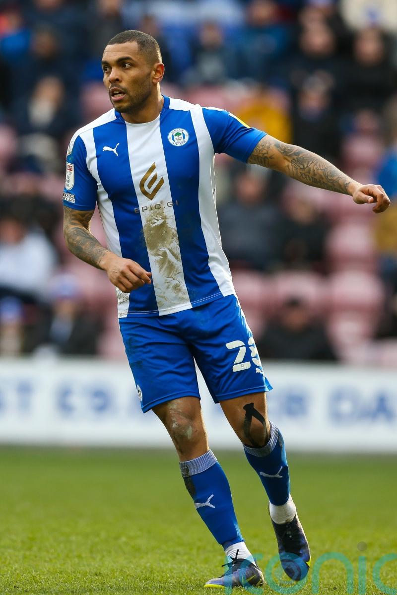Wigan crank up pressure on leaders with thumping win over struggling Morecambe