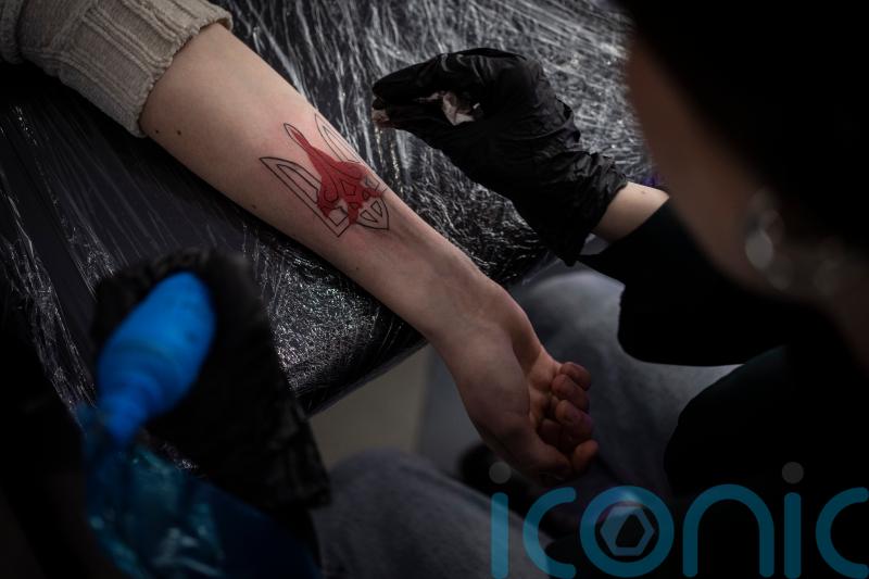Patriotic messages in tattoos and on billboards become popular in Ukraine