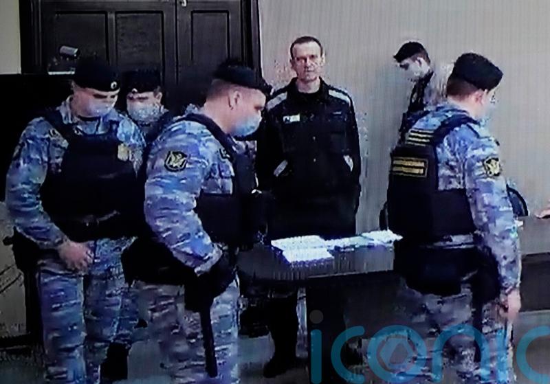 Putin foe Alexei Navalny given nine-year jail term by Russian court