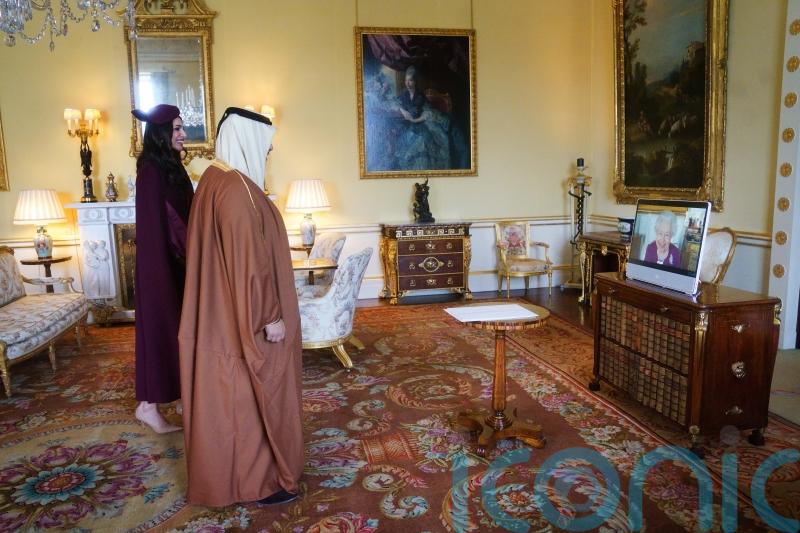Queen in regal purple for virtual diplomatic audiences