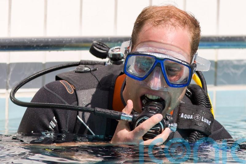 Duke of Cambridge plants coral with Earthshot Prize winner