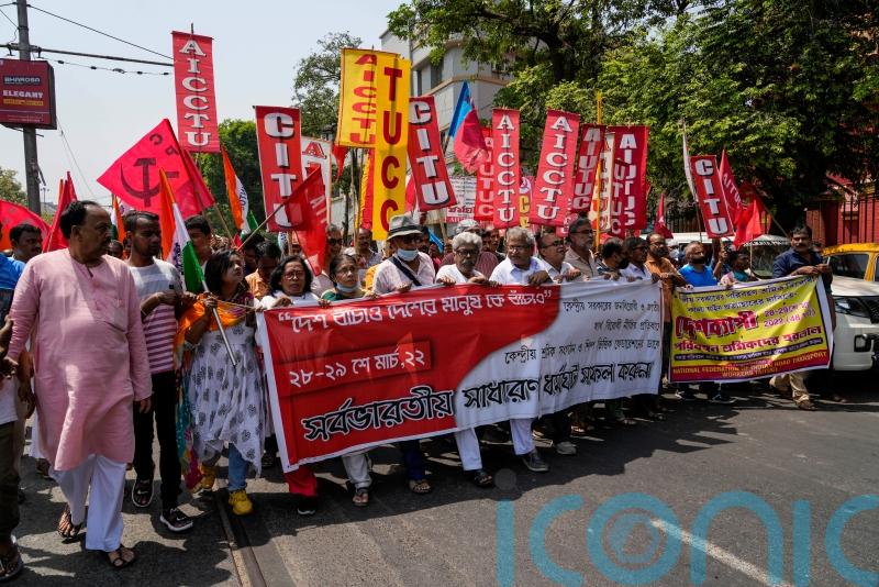 Millions of workers go on strike across India demanding more rights