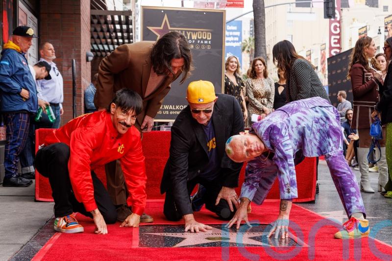 Red Hot Chili Peppers pay tribute to LA hometown at Walk Of Fame star ceremony