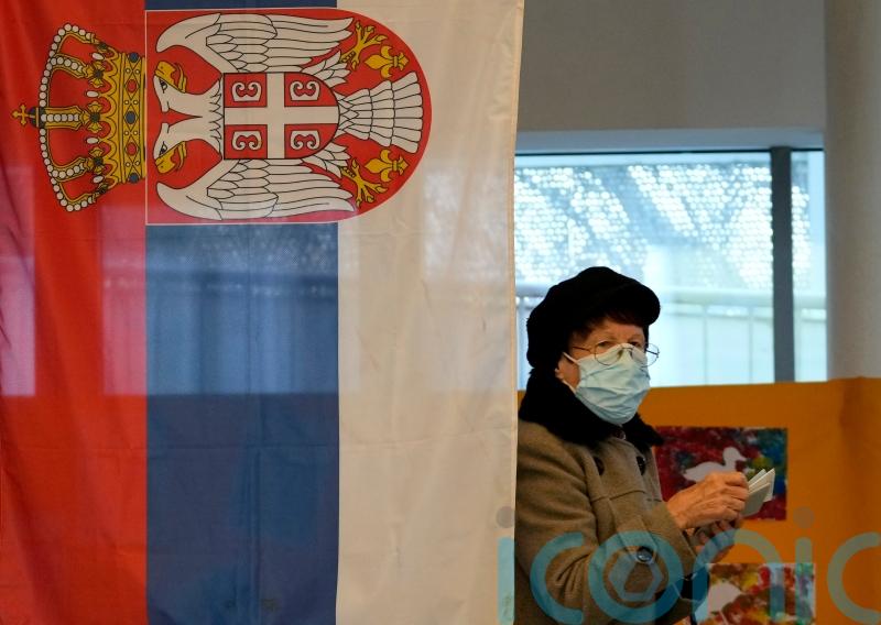 Serbs vote in triple election set to keep populists in power