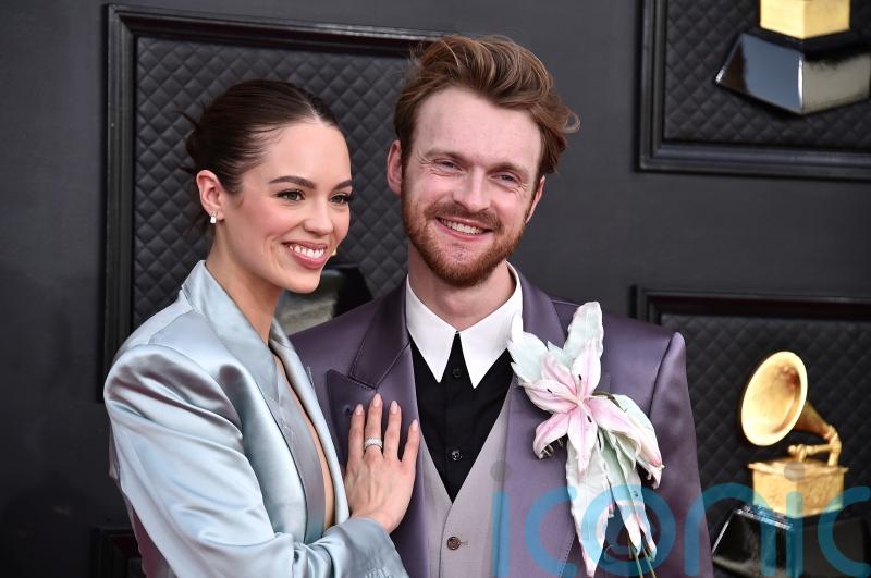 Finneas teases Grammys performance with sister Billie Eilish on red carpet