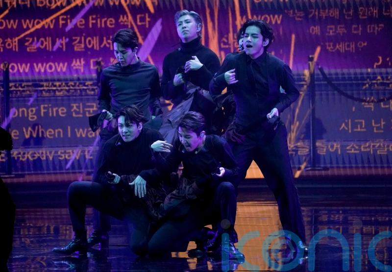 BTS deliver flirtation and a fall during Grammys performance