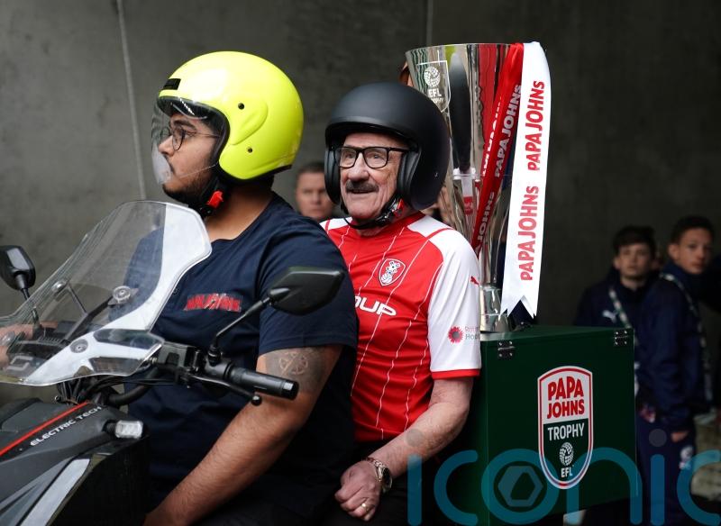 Paul Chuckle and Tim Vine deliver Wembley football trophy on takeaway bikes