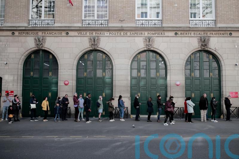 France goes to the polls as Macron faces strong challenge from Le Pen