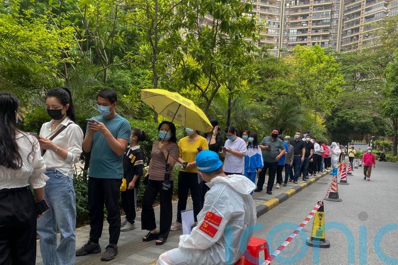 Chinese city of Guangzhou shuts schools in battle with Covid surge