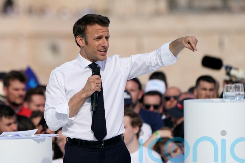 Macron courts Marseille voters as climate activists stage Paris demo