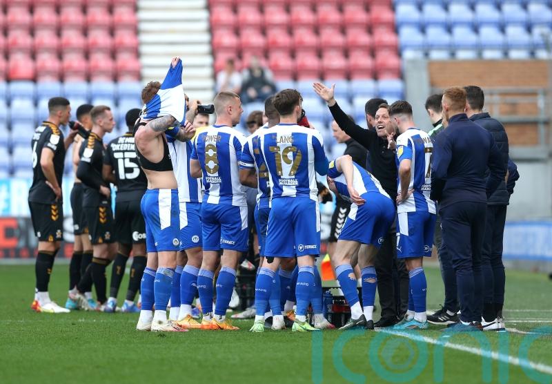 Cambridge’s Mark Bonner backs Wigan to go up despite his side halting their run