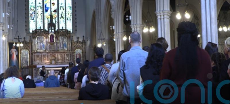 How has Christianity provided a sense of community for Afghan refugees?
