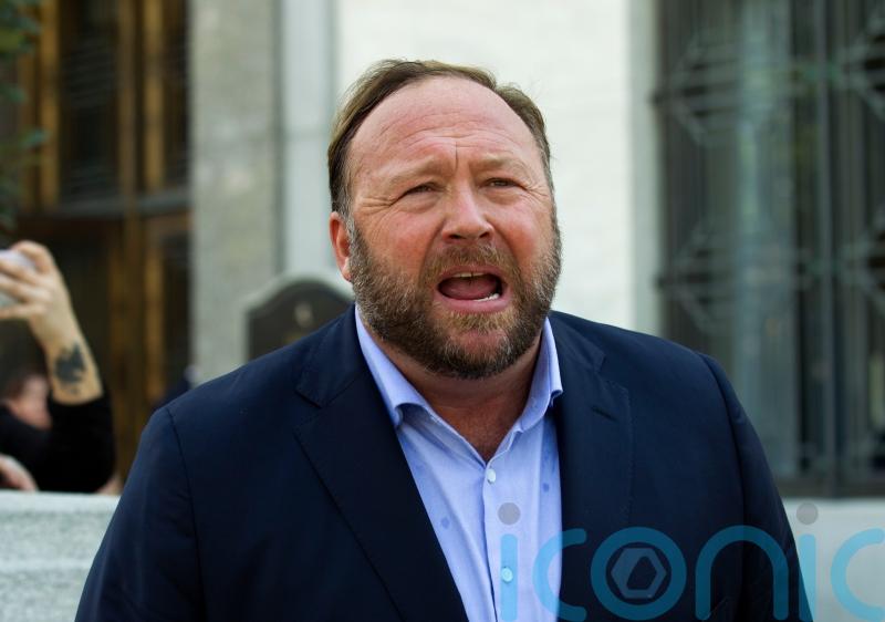 Conspiracy website Infowars files for bankruptcy as founder faces libel lawsuits