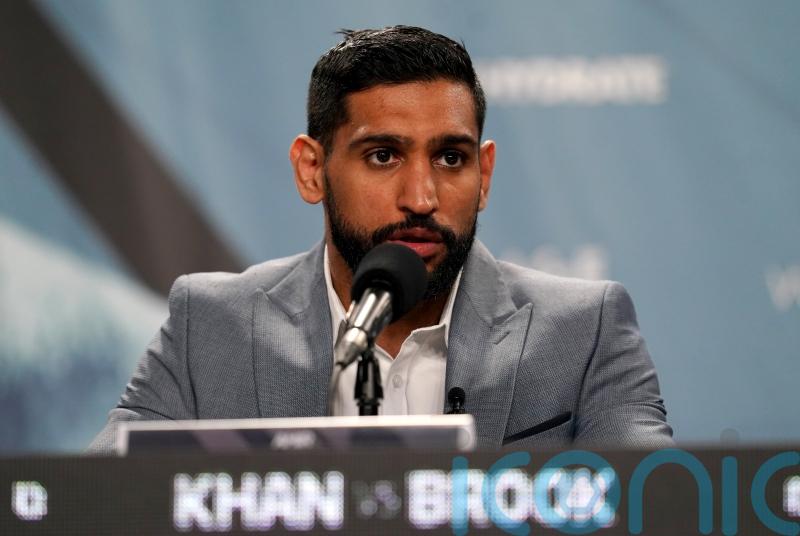 Former world champion Amir Khan says he has been robbed at gunpoint
