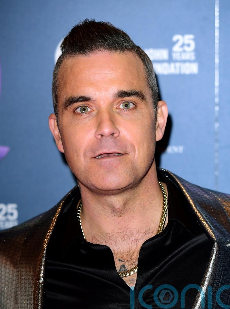 Robbie Williams and Ed Godrich to auction off artworks