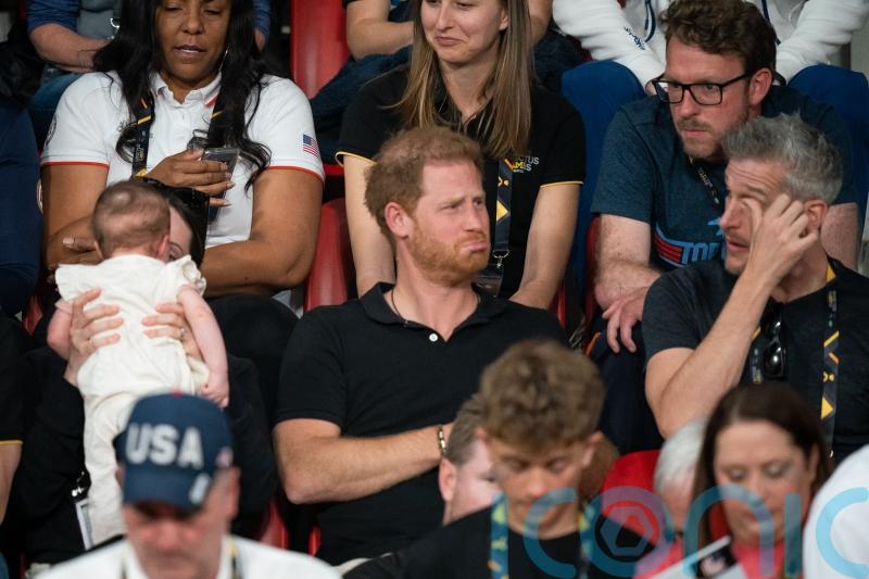 Harry appears to warn those around the Queen he’ll make sure she is ‘protected’