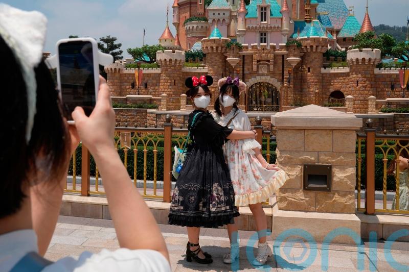 Hong Kong Disneyland reopens as Covid cases ease but deaths rise in Shanghai