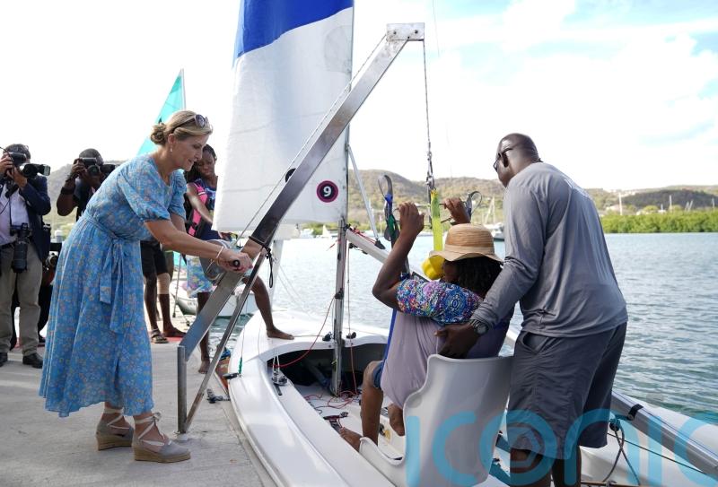Sophie hoists disabled woman into boat and hugs boy, eight, at sailing academy
