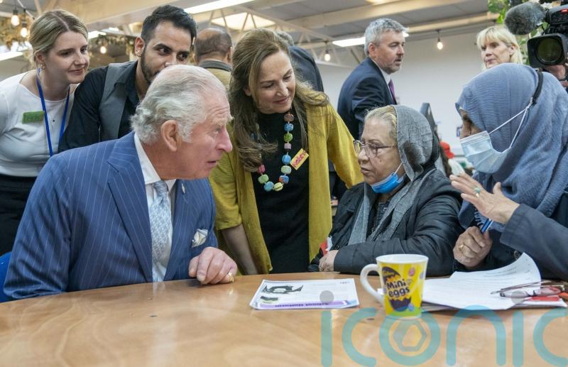 Charles expresses concern for asylum seekers during community centre visit