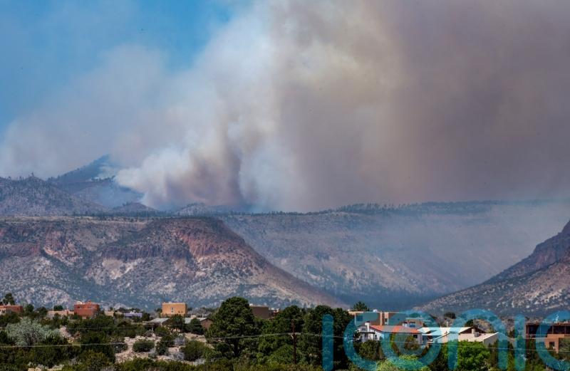 Firefighters battling New Mexico blaze brace for windy conditions