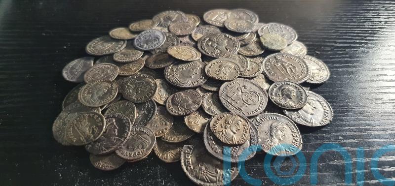 Detectorist friends find hoard of 161 Roman coins beneath their campsite