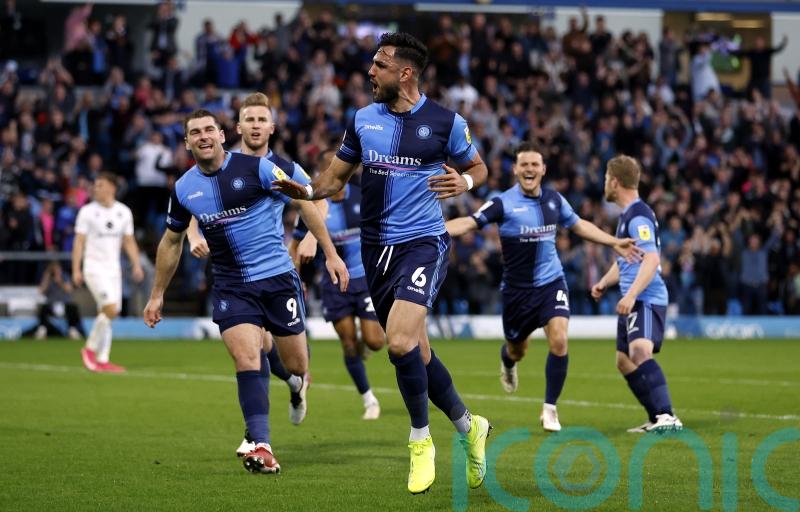 Wycombe claim 2-0 win over 10-man MK Dons in first leg of play-off semi-final