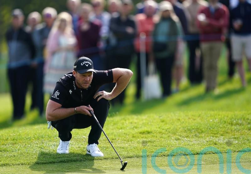 Tournament host Danny Willett battles back into contention at British Masters
