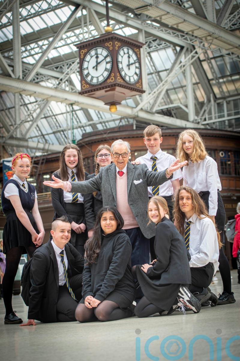 Holocaust survivor, 98, shares story with pupils at station where he arrived