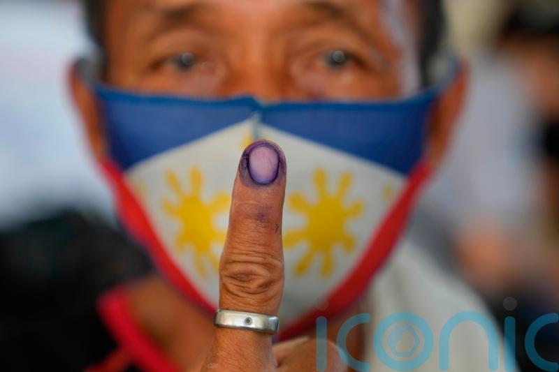 Philippines presidential race narrows to Marcos Jr and human rights lawyer