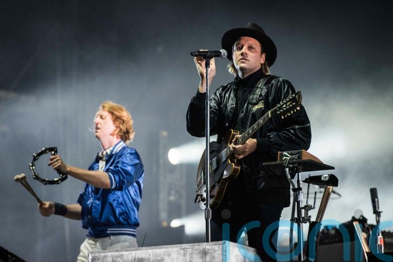 Arcade Fire celebrate chart success with sixth album We