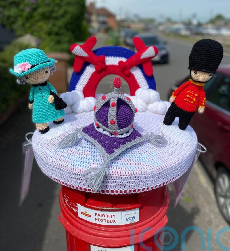 Crafters pick up crochet hooks to decorate post boxes ahead of Queen’s Jubilee