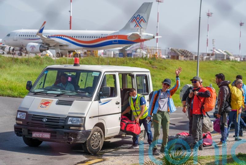 Hundreds of Everest climbers begin to return from summit