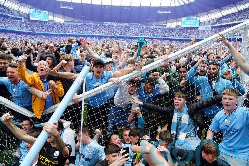 Two fans charged following Etihad pitch invasion after Man City title win